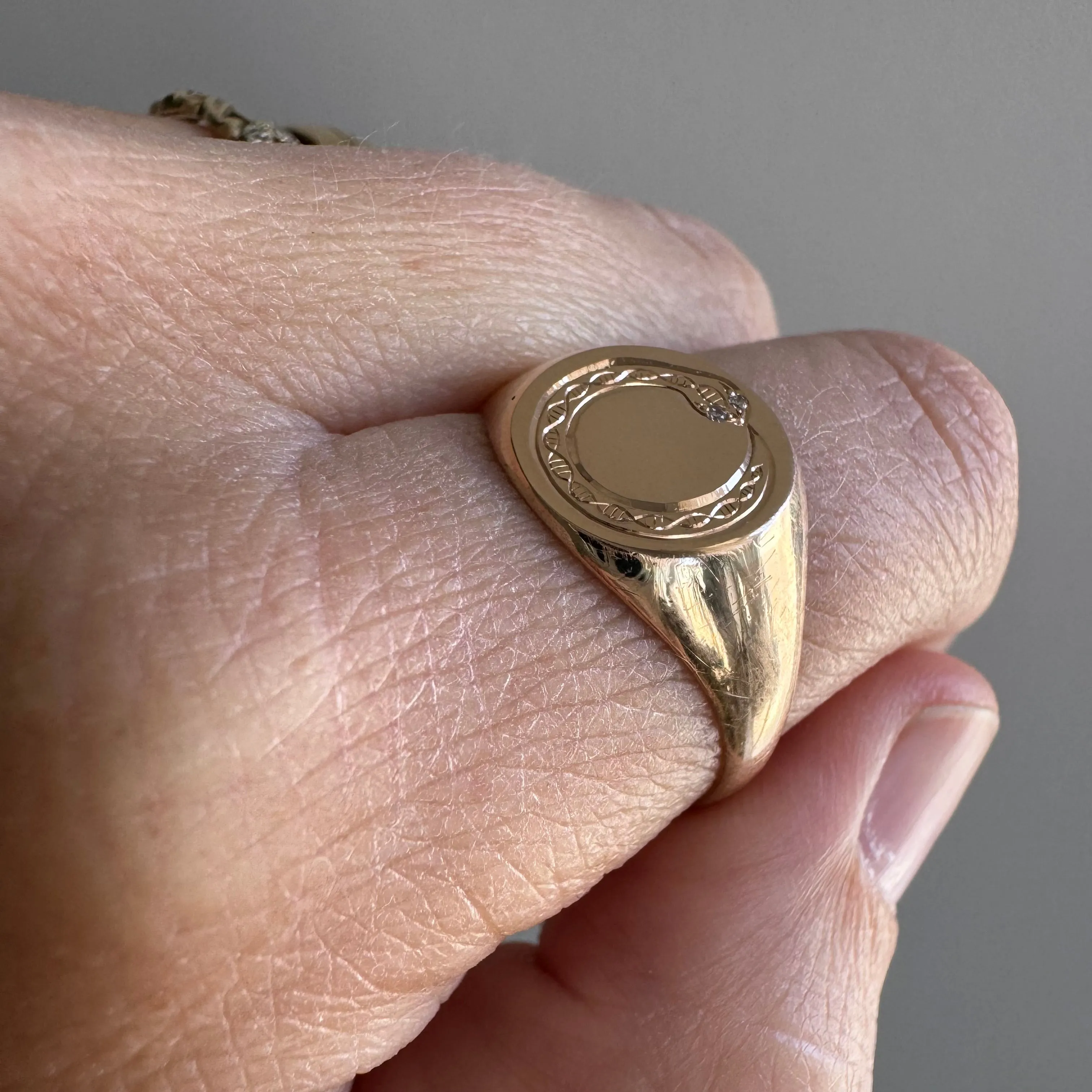 reimagined A N T I Q U E // ouroboros cycle / 10k rosy gold round signet with engraved snake and diamonds / size 9.25 to 9.5